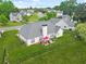 Aerial view of a spacious, fenced backyard with a patio dining set at 380 Vista Creek Dr, Stockbridge, GA 30281