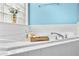 Close up of a relaxing soaking tub with tile surround and spa accessories at 380 Vista Creek Dr, Stockbridge, GA 30281