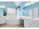 Serene bathroom with a soaking tub, white cabinets and blue walls at 380 Vista Creek Dr, Stockbridge, GA 30281