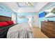 Stylish bedroom with blue accent wall, tray ceiling, and modern decor at 380 Vista Creek Dr, Stockbridge, GA 30281