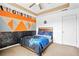 Bedroom featuring a custom painted wall, carpet, ceiling fan, and a bed with a comforter at 380 Vista Creek Dr, Stockbridge, GA 30281