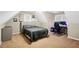 Spacious bedroom featuring carpet, two windows, a bed, and a gaming setup at 380 Vista Creek Dr, Stockbridge, GA 30281