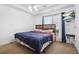 Cozy bedroom with a bed, window with curtains, ceiling fan, and mounted television at 380 Vista Creek Dr, Stockbridge, GA 30281