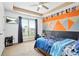 Bedroom featuring a custom painted wall, carpet, ceiling fan, and a mounted television at 380 Vista Creek Dr, Stockbridge, GA 30281