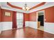 Dining room with wainscoting, cherry hardwood floors and large window at 380 Vista Creek Dr, Stockbridge, GA 30281