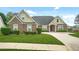 Beautiful single-story brick home with manicured lawn, charming curb appeal and driveway at 380 Vista Creek Dr, Stockbridge, GA 30281