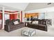 Living room featuring modern sofas, open layout, high ceilings, and a view of the kitchen at 380 Vista Creek Dr, Stockbridge, GA 30281