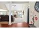 Open-concept living room with a fireplace, hardwood floors, and neutral paint at 380 Vista Creek Dr, Stockbridge, GA 30281