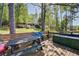 Secluded backyard featuring a deck with built-in seating and wooded views, perfect for outdoor entertaining at 455 Mayo Rd, Covington, GA 30014
