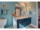 Bathroom with a vanity, sink, and turquoise walls at 455 Mayo Rd, Covington, GA 30014