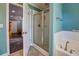 Bathroom featuring a walk-in shower, white tile and glass doors at 455 Mayo Rd, Covington, GA 30014