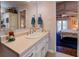 Well-lit bathroom with ample counter space and views to the bedroom, seamlessly blending comfort and convenience at 455 Mayo Rd, Covington, GA 30014