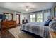 Spacious bedroom featuring a view of the lake, access to the outside, and plenty of storage at 455 Mayo Rd, Covington, GA 30014