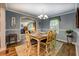 Inviting dining room with decorative table and chairs, and access to living area at 455 Mayo Rd, Covington, GA 30014