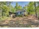 Lovely home with a screened porch surrounded by mature trees, providing a peaceful and private outdoor space at 455 Mayo Rd, Covington, GA 30014