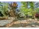 A charming home with a large front yard, circular driveway and three-car garage at 455 Mayo Rd, Covington, GA 30014