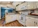 White kitchen with tile backsplash and stainless steel faucet overlooking a water view at 455 Mayo Rd, Covington, GA 30014