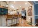 Bright kitchen featuring wood floors, a skylight, and bar seating at 455 Mayo Rd, Covington, GA 30014