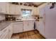 Clean kitchen with white cabinets and a view from the window at 455 Mayo Rd, Covington, GA 30014