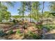 Beautiful lake view from the landscaped backyard, showcasing mature trees and a tranquil waterfront at 455 Mayo Rd, Covington, GA 30014