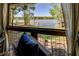 Serene lake view framed by a window, showcasing the waterfront landscape and lush trees at 455 Mayo Rd, Covington, GA 30014