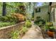 Professionally landscaped yard and stone retaining wall add curb appeal at 455 Mayo Rd, Covington, GA 30014