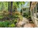 Beautiful landscaping featuring vibrant flowers and a charming walkway to the house at 455 Mayo Rd, Covington, GA 30014