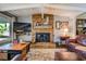 Inviting living room with a stone fireplace, hardwood floors, and comfortable seating at 455 Mayo Rd, Covington, GA 30014