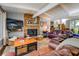Inviting living room with a stone fireplace, hardwood floors, and comfortable seating at 455 Mayo Rd, Covington, GA 30014