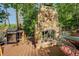 Outdoor stone fireplace featuring a Texas star for cozy lakeside evenings at 455 Mayo Rd, Covington, GA 30014