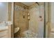 Walk-in shower featuring stone flooring and a rainfall showerhead, offering a spa-like experience at home at 455 Mayo Rd, Covington, GA 30014