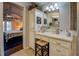 Traditional vanity with storage and views into the bedroom, boasting a seamless blend of functionality and style at 455 Mayo Rd, Covington, GA 30014