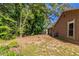 Backyard surrounded by mature trees at 5326 Rocky Pine Dr, Lithonia, GA 30038