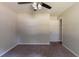 This bedroom has neutral walls, carpeted floors, and a ceiling fan with lighting at 5326 Rocky Pine Dr, Lithonia, GA 30038