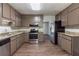 The spacious kitchen is equipped with stainless steel appliances, ample countertop space, and dark wood cabinets at 5326 Rocky Pine Dr, Lithonia, GA 30038
