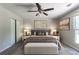 A staged main bedroom suite showcases a bed and coordinated decor at 5326 Rocky Pine Dr, Lithonia, GA 30038