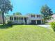 Charming two-story home with a covered front porch and attached two-car garage on a well-manicured lawn at 589 Catrina Ct, Stone Mountain, GA 30087
