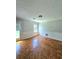 Bright room with hardwood flooring and a door leading to the outdoors at 589 Catrina Ct, Stone Mountain, GA 30087