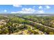 An aerial view of the community surrounded by dense trees and a blue sky at 379 Villa Rosa Way, Temple, GA 30179
