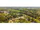 Overhead perspective of a tranquil neighborhood surrounded by mature trees and scenic views of a beautiful lake at 379 Villa Rosa Way, Temple, GA 30179