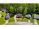 Aerial view of neighborhood homes featuring green lawns and mature trees at 379 Villa Rosa Way, Temple, GA 30179