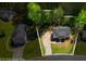 An aerial view outlines property lines with homes in a wooded neighborhood at 379 Villa Rosa Way, Temple, GA 30179