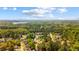 Overhead shot of the surrounding community with lush greenery and blue skies at 379 Villa Rosa Way, Temple, GA 30179