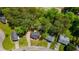 Aerial view showcasing neighborhood homes with green lawns and mature trees at 379 Villa Rosa Way, Temple, GA 30179