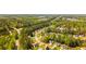 An aerial shot of a neighborhood featuring lush greenery and well-maintained homes at 379 Villa Rosa Way, Temple, GA 30179