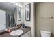 Bathroom featuring a single sink vanity, large mirror, and shower with tub at 379 Villa Rosa Way, Temple, GA 30179