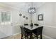 Charming dining area with modern lighting, stylish decor, and seating for four at 379 Villa Rosa Way, Temple, GA 30179