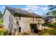 Back exterior view of home showing yard, wooden deck, and well maintained lawn at 379 Villa Rosa Way, Temple, GA 30179