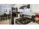 Efficient kitchen with black appliances, bright white cabinets, and an adjacent dining area at 379 Villa Rosa Way, Temple, GA 30179