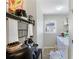 Bright and functional laundry room equipped with washer, dryer, and storage space at 379 Villa Rosa Way, Temple, GA 30179